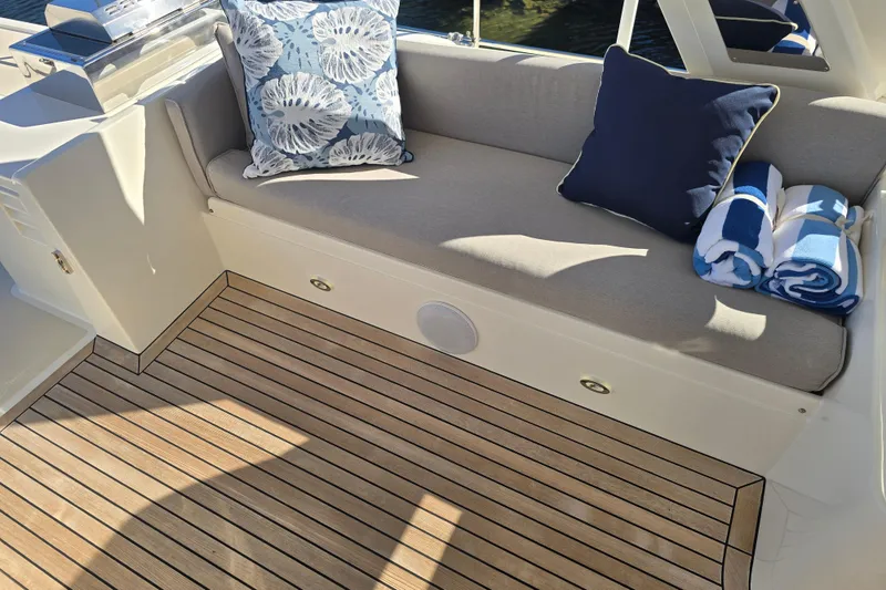 Slide: The Image of Luxurious seating area on 2018 Fleming 58 Pilothouse yacht with cushions and towels. - 28