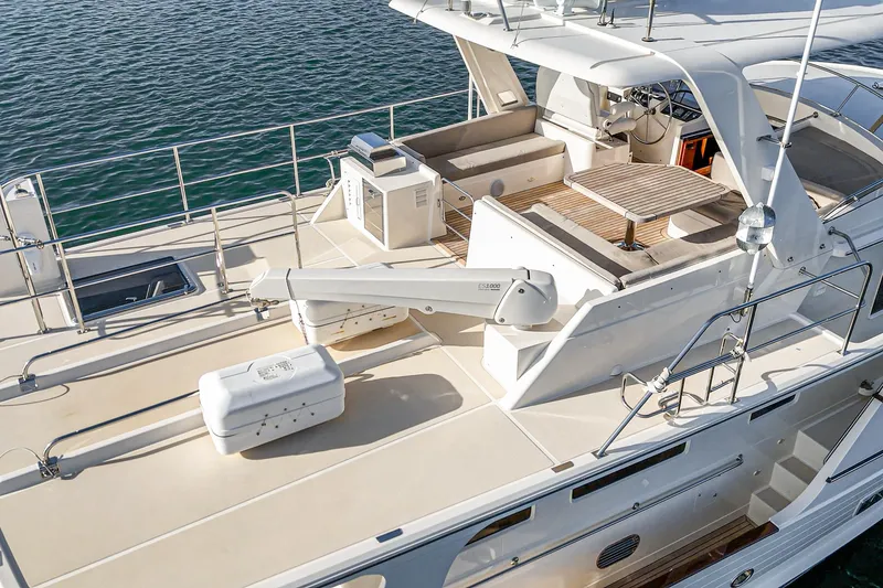 Slide: The Image of 2018 Fleming 58 Pilothouse yacht deck with seating and ocean view. - 32