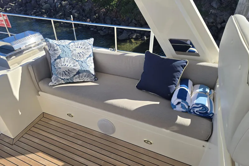 Slide: The Image of Luxurious seating area on 2018 Fleming 58 Pilothouse yacht with cushions and towels. - 33