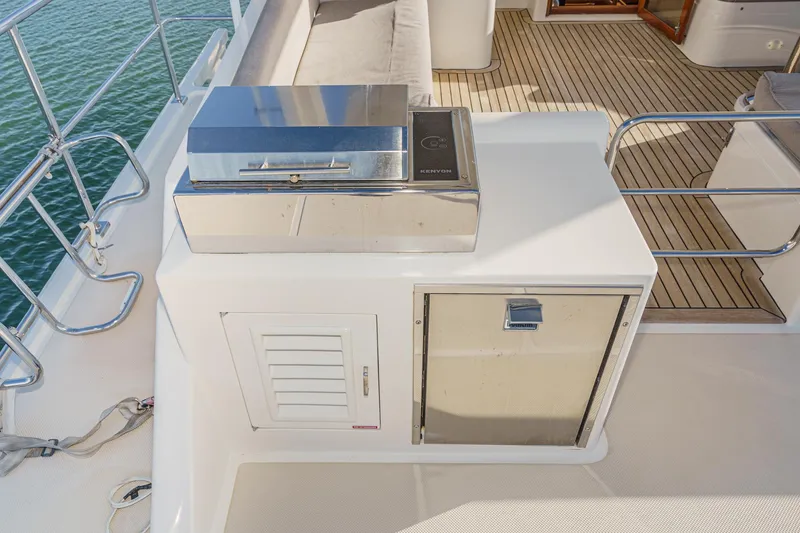 Slide: The Image of Outdoor kitchen area on 2018 Fleming 58 Pilothouse yacht with grill and storage. - 36