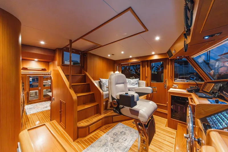 Slide: The Image of Luxurious 2018 Fleming 58 Pilothouse interior with elegant wood finish and modern navigation equipment. - 41