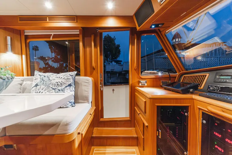Slide: The Image of Luxurious interior of 2018 Fleming 58 Pilothouse yacht with elegant wood finish and plush seating. - 42