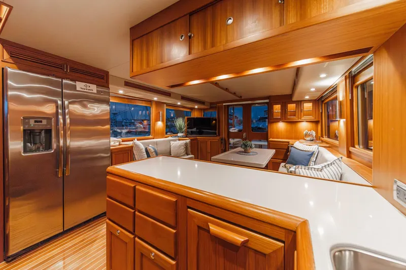 Slide: The Image of Luxurious 2018 Fleming 58 Pilothouse yacht interior with elegant wood finishes and modern amenities. - 48