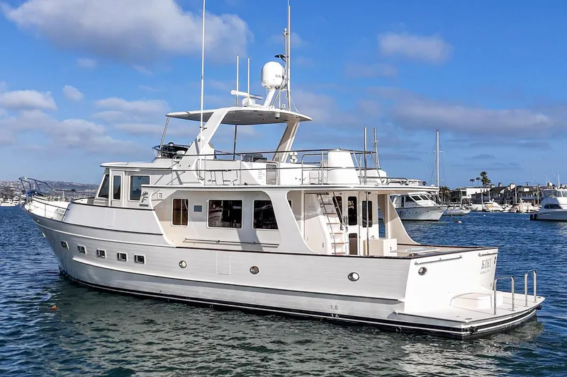 Slide: The Image of 2018 Fleming 58 Pilothouse yacht on calm water under blue sky. - 5