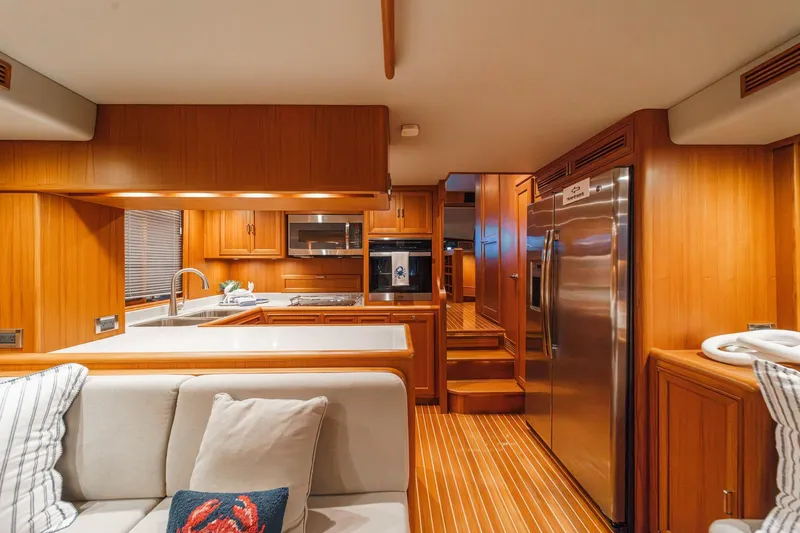 Slide: The Image of Luxurious 2018 Fleming 58 Pilothouse yacht interior with modern kitchen and cozy seating area. - 52