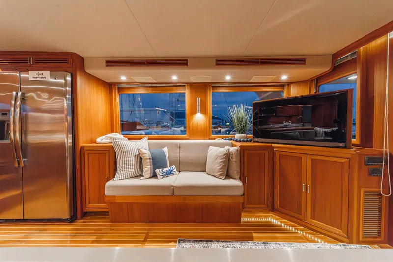 Slide: The Image of Luxurious interior of 2018 Fleming 58 Pilothouse yacht with cozy seating and modern amenities. - 53