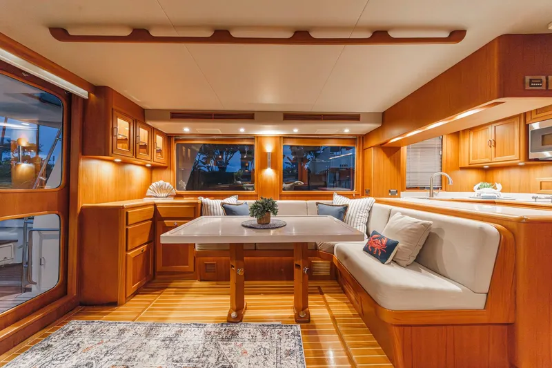 Slide: The Image of Luxurious interior of 2018 Fleming 58 Pilothouse yacht with elegant wood finishes and cozy seating. - 54