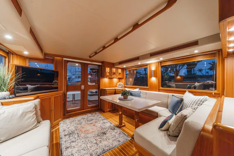 Slide: The Image of Luxurious interior of 2018 Fleming 58 Pilothouse yacht with elegant wood finishes and cozy seating. - 55