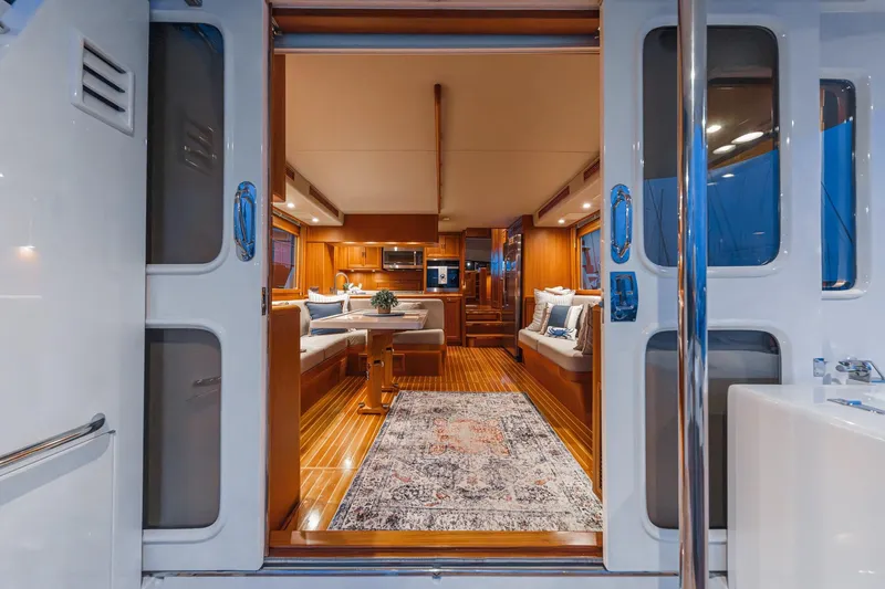 Slide: The Image of Luxurious interior of 2018 Fleming 58 Pilothouse yacht with elegant wood finishes. - 59