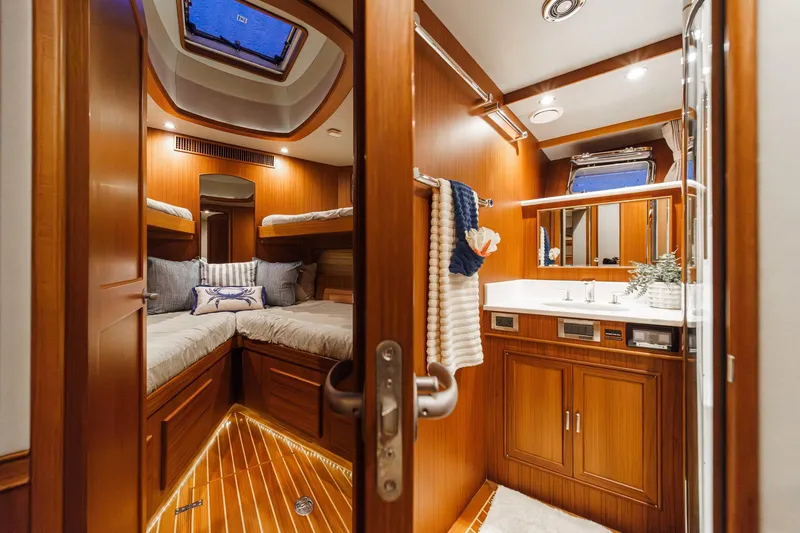 Slide: The Image of Luxurious 2018 Fleming 58 Pilothouse yacht interior with cozy cabin and elegant bathroom. - 62
