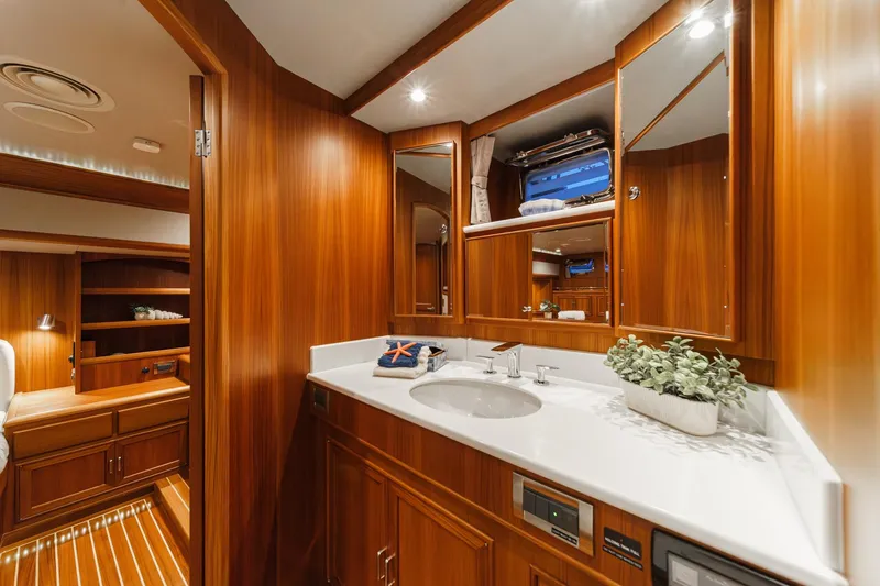 Slide: The Image of Luxurious bathroom interior of 2018 Fleming 58 Pilothouse yacht with wooden cabinetry. - 70