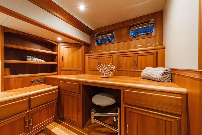 Slide: The Image of Luxurious wooden interior of 2018 Fleming 58 Pilothouse yacht with elegant cabinetry. - 73