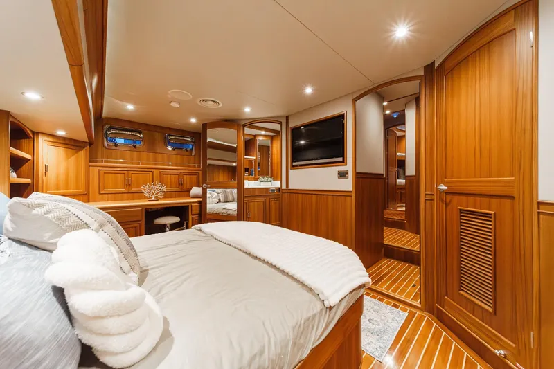 Slide: The Image of Luxurious 2018 Fleming 58 Pilothouse yacht interior with elegant wood finish and cozy bedroom. - 75