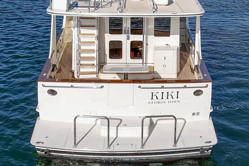 Slide: The Image of 2018 Fleming 58 Pilothouse yacht, rear view, on water, named "KIKI" from George Town. - 78