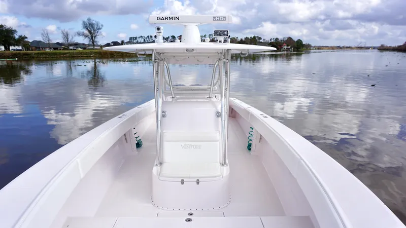 Slide: The Image of 2009 Venture 39 Open boat on calm water under cloudy sky. - 13