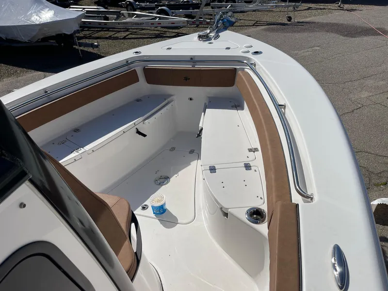Slide: The Image of 2024 Sea Pro 242 Center Console boat interior with seating and storage compartments. - 14