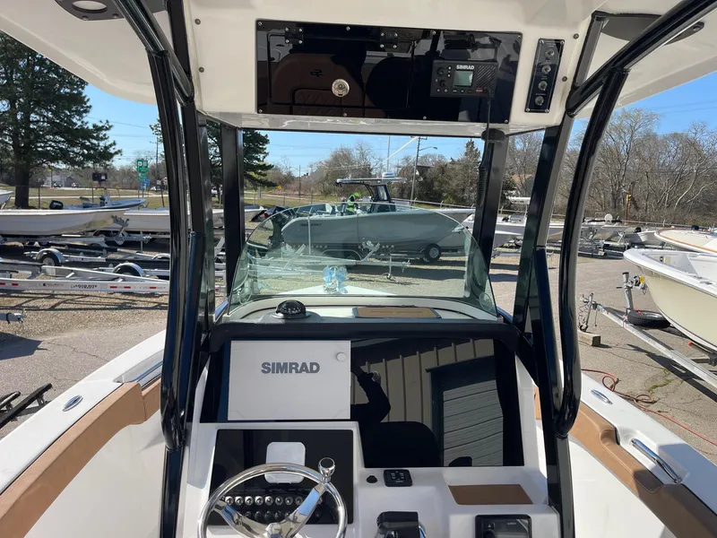 Slide: The Image of 2024 Sea Pro 242 Center Console boat interior with Simrad navigation system. - 5