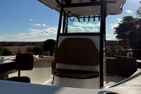 Slide: The Image of 2024 Sea Pro 242 Center Console boat with scenic outdoor backdrop. - 6