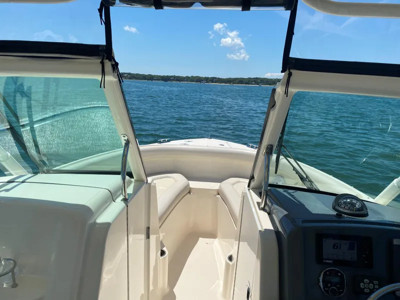 Slide: The Image of 2013 Pursuit D 265 Dual Console boat on a sunny lake. - 3