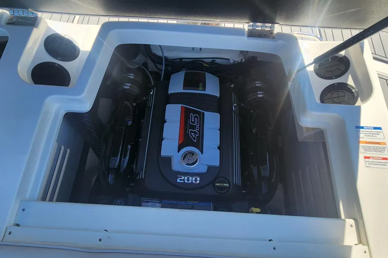 Slide: The Image of Engine compartment of 2021 Sea Ray SPX 190 boat, featuring a 4.5L 200 HP engine. - 12
