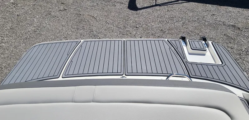 Slide: The Image of 2021 Sea Ray SPX 190 boat deck with sleek gray flooring design. - 16