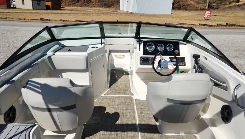 Slide: The Image of 2021 Sea Ray SPX 190 boat interior with dual seats and modern dashboard. - 6