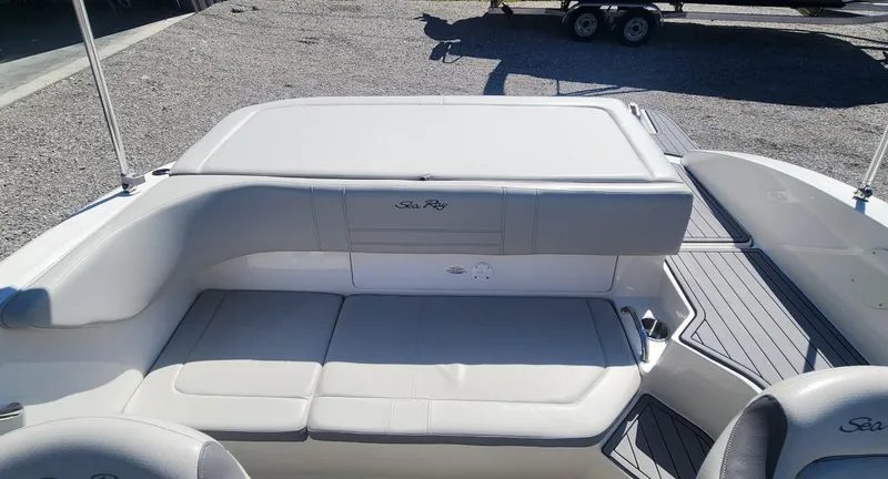 Slide: The Image of 2021 Sea Ray SPX 190 boat interior with cushioned seating and sleek design. - 7