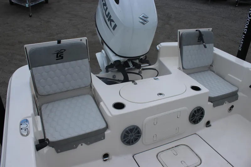 Slide: The Image of 2025 Carolina Skiff 23 LS boat interior with Suzuki engine and seating. - 5