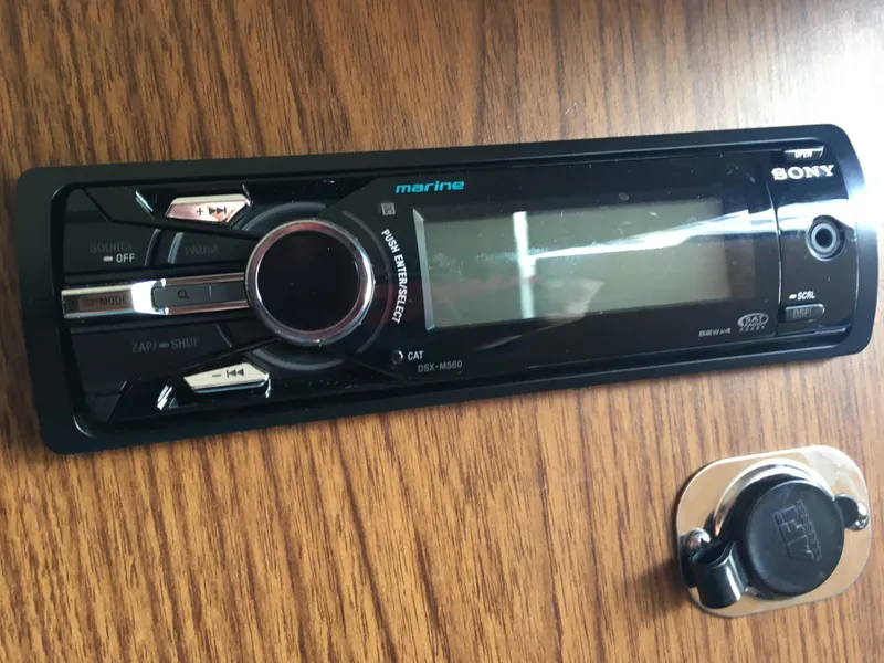 Slide: The Image of Sony marine stereo on a 1976 Bertram 26 Moppie boat's wooden dashboard. - 16