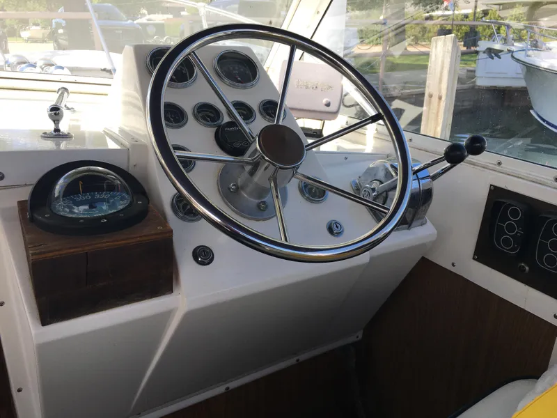 Slide: The Image of 1976 Bertram 26 Moppie helm with steering wheel and instrument panel. - 9