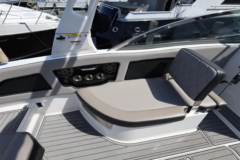Slide: The Image of 2020 Bryant Calandra 23 boat interior with cushioned seating and modern design. - 31