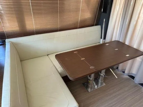 Slide: The Image of Luxurious interior of 2023 Bavaria R40 Coupe with elegant seating and wooden table. - 26