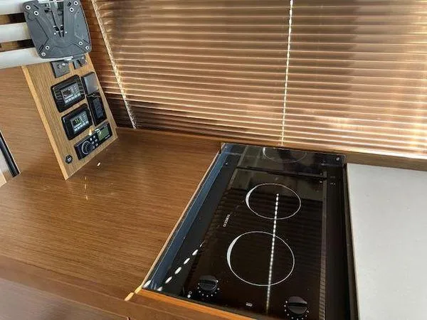Slide: The Image of 2023 Bavaria R40 Coupe kitchen with induction cooktop and control panel. - 27