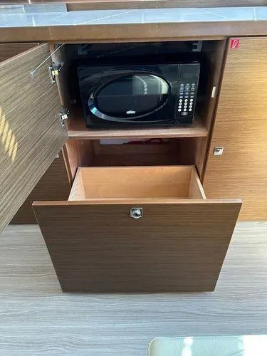 Slide: The Image of 2023 Bavaria R40 Coupe kitchen cabinet with microwave and storage drawer. - 34