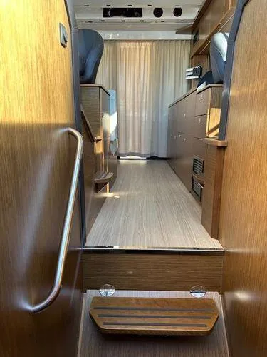 Slide: The Image of Interior of 2023 Bavaria R40 Coupe, featuring sleek wooden design and modern furnishings. - 47