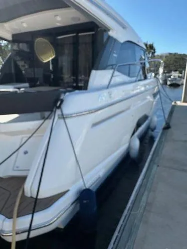Slide: The Image of 2023 Bavaria R40 Coupe yacht docked at marina, side view. - 5