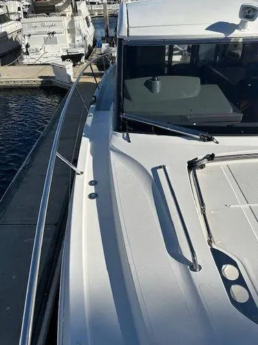 Slide: The Image of 2023 Bavaria R40 Coupe yacht docked at marina, showcasing sleek design and modern features. - 7