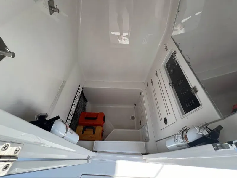 Slide: The Image of 2013 Jupiter 30 FS boat interior with storage and safety equipment. - 14