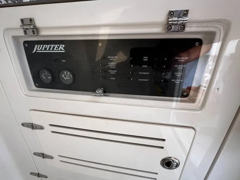 Slide: The Image of Control panel of a 2013 Jupiter 30 FS boat with gauges and switches. - 17