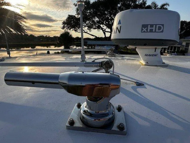 Slide: The Image of Close-up of a 2013 Jupiter 30 FS boat's radar and equipment at sunset. - 19