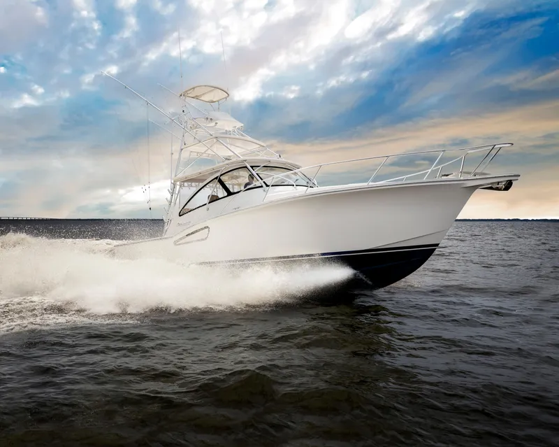 The Image of 2025 Albemarle 36 Express boat cruising on open water under a cloudy sky. - 0