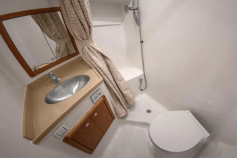Slide: The Image of 2025 Albemarle 36 Express bathroom with sink, shower, and toilet. - 11