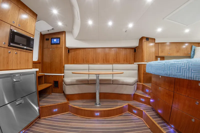 Slide: The Image of Luxurious interior of 2025 Albemarle 36 Express yacht with modern amenities and elegant wood finishes. - 5