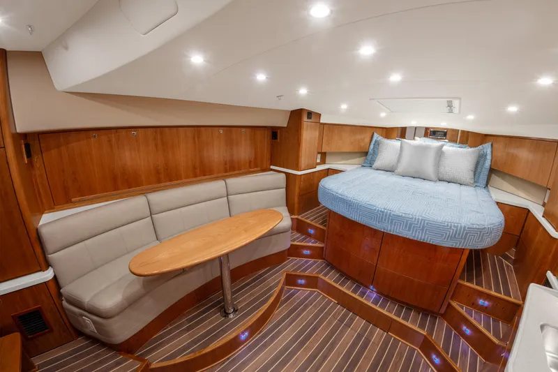 Slide: The Image of Luxurious interior of 2025 Albemarle 36 Express yacht with cozy seating and elegant wood finishes. - 6