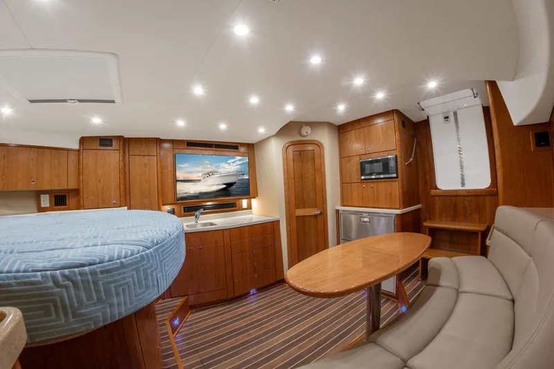 Slide: The Image of Luxurious interior of 2025 Albemarle 36 Express yacht with modern amenities and elegant wood finish. - 8