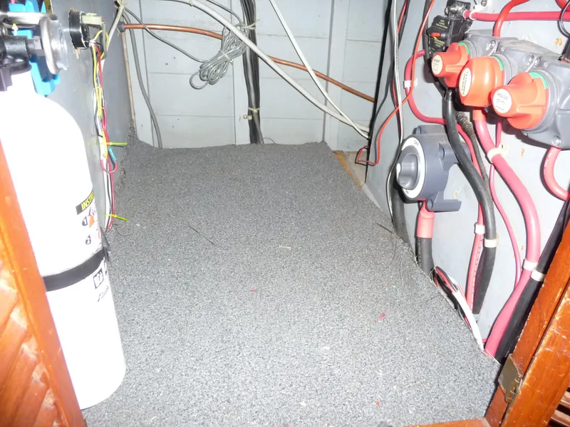 Slide: The Image of Electrical wiring and components inside a 1956 Monk 33 Sedan Cruiser boat. - 21