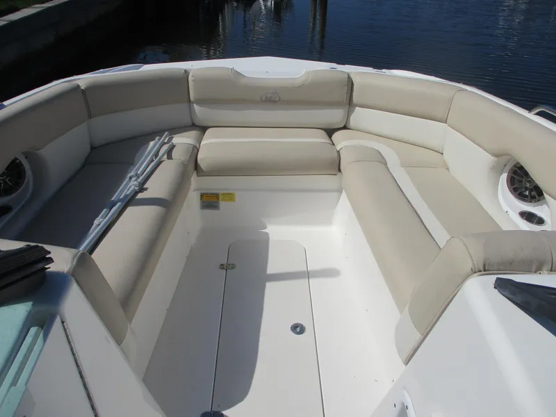 Slide: The Image of 2018 NauticStar 243DC Sport Deck boat interior with beige seating. - 7