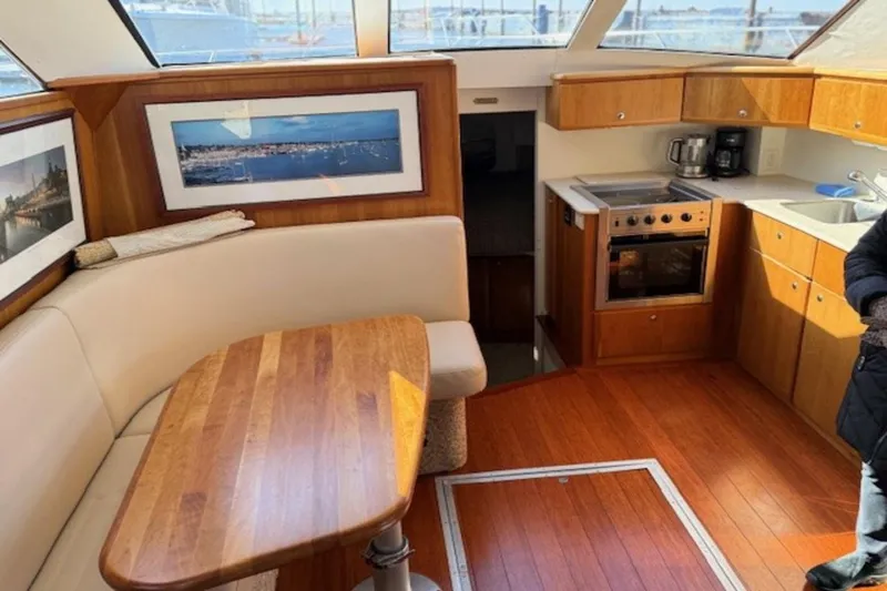 Slide: The Image of Interior of 2001 Silverton 392 Motoryacht with kitchen and dining area. - 15