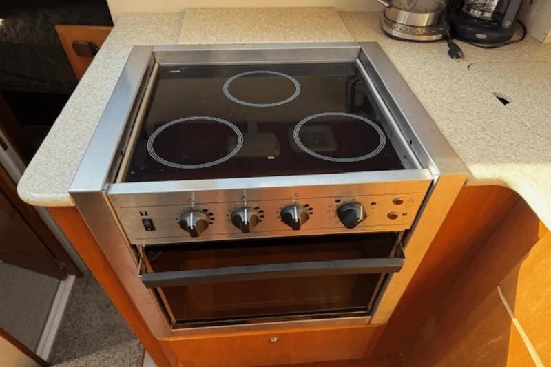 Slide: The Image of Stove and oven in 2001 Silverton 392 Motoryacht kitchen area. - 18