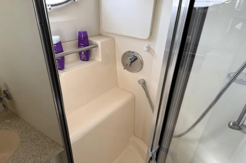 Slide: The Image of Shower area in 2001 Silverton 392 Motoryacht with toiletries and glass door. - 30